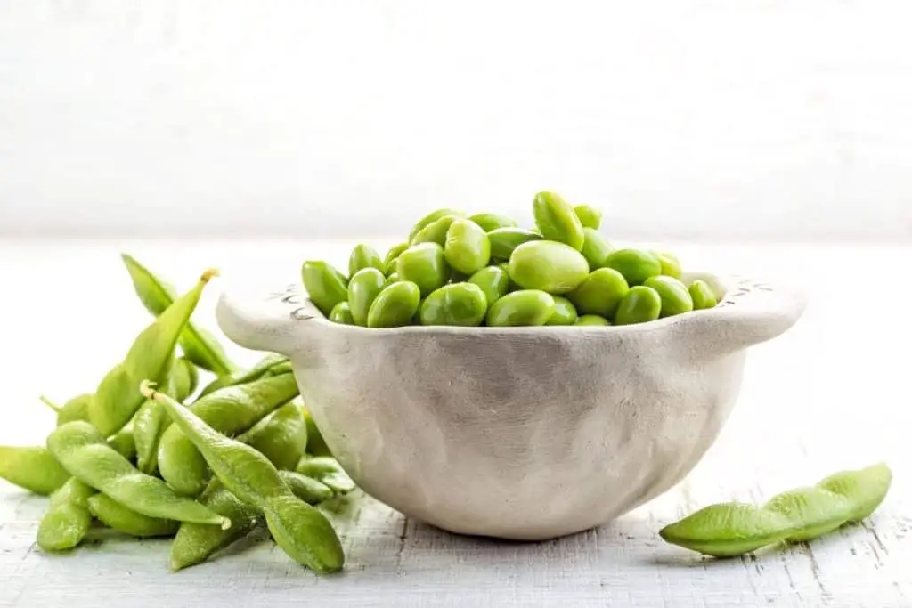 Edamame beans in a white bowl